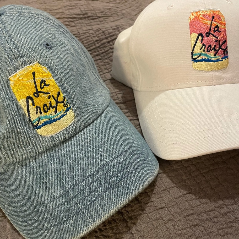 Two LaCroix brand dad hats.